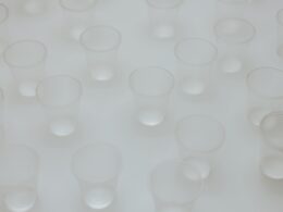 Clear Round Plastic Containers on White Surface