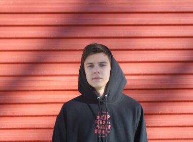 man wearing black and red pullover hoodie